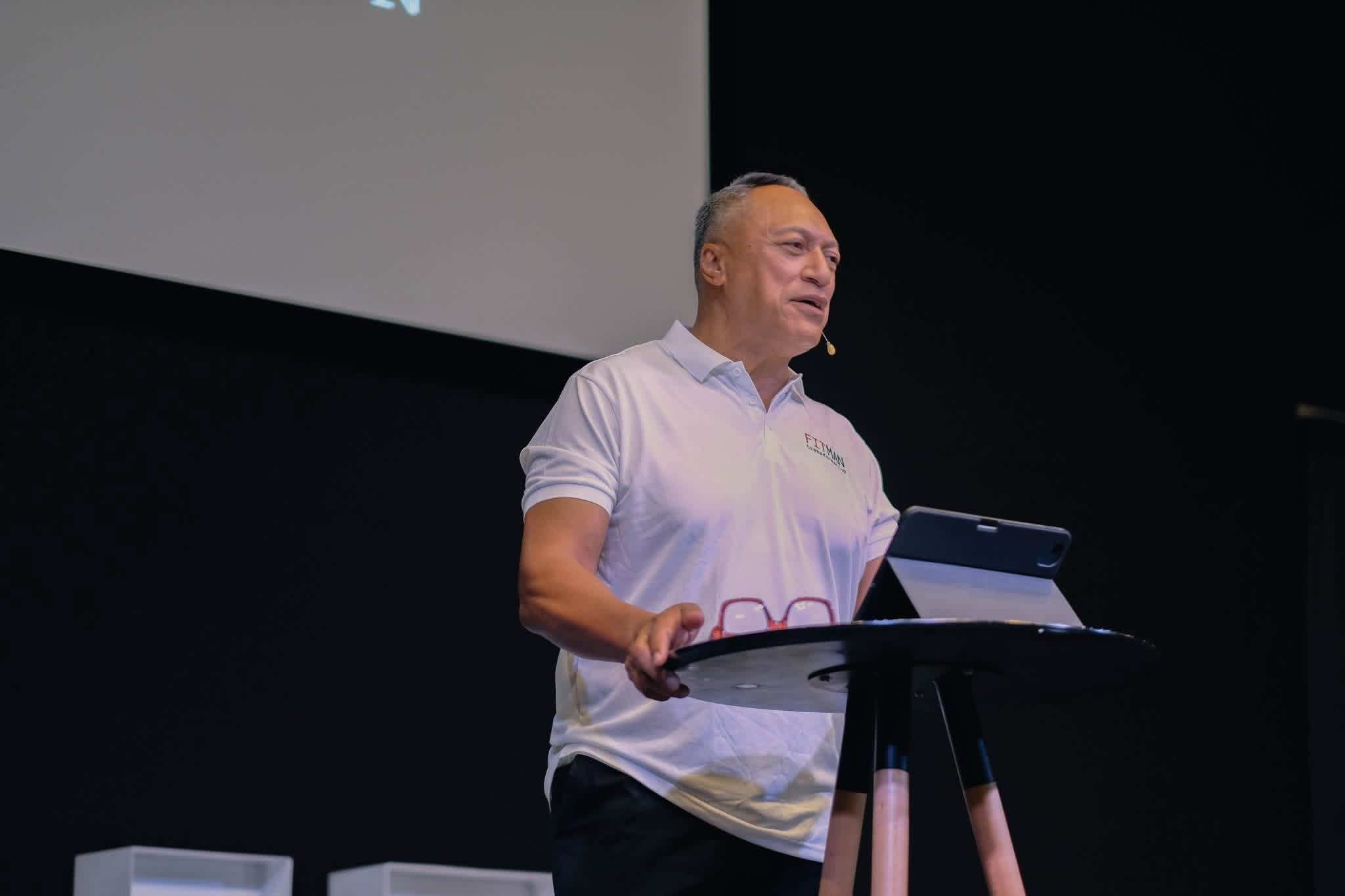 A speaker addressing FITMAN Conference