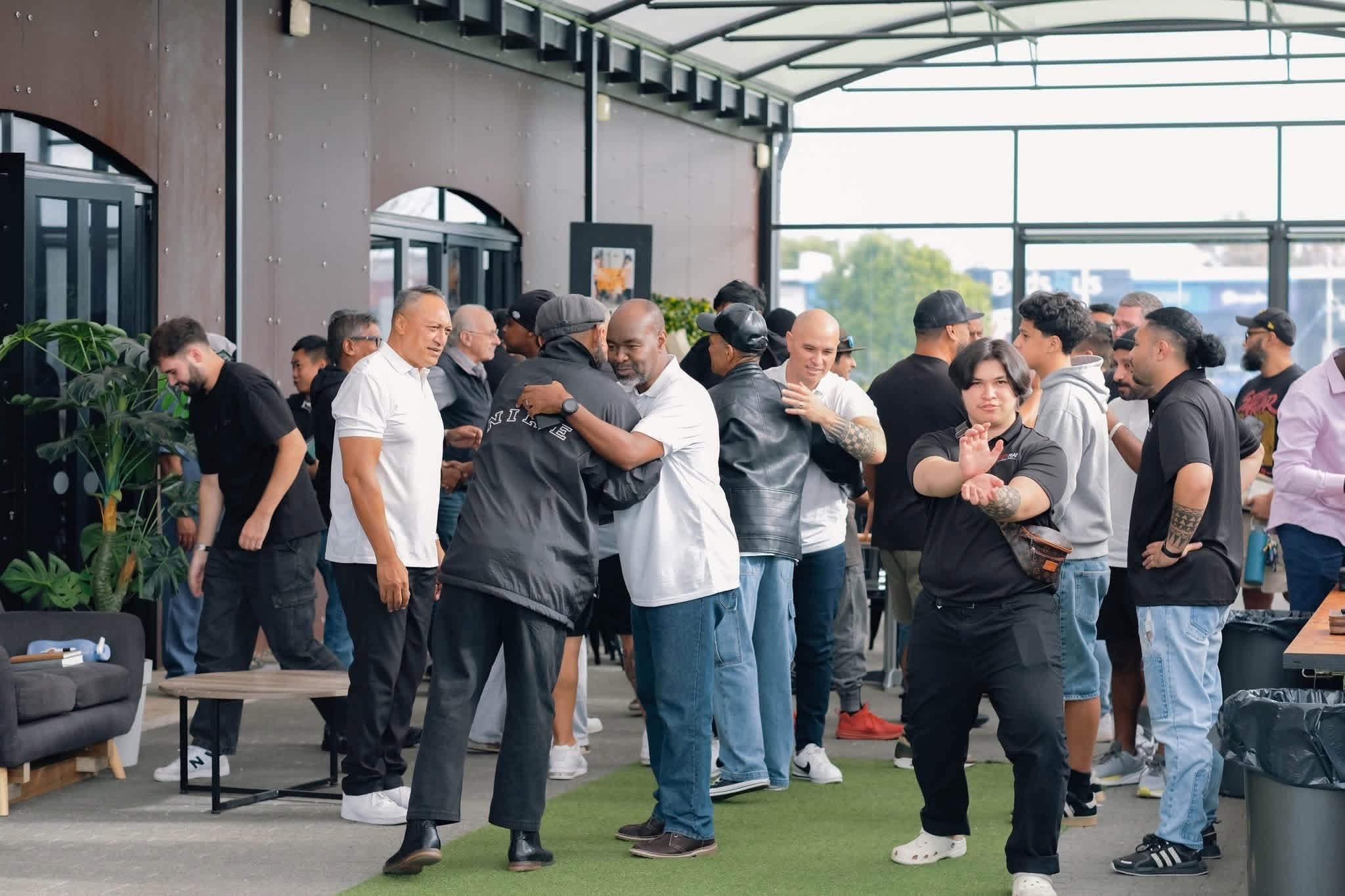 Men gathered together outside the conference venue