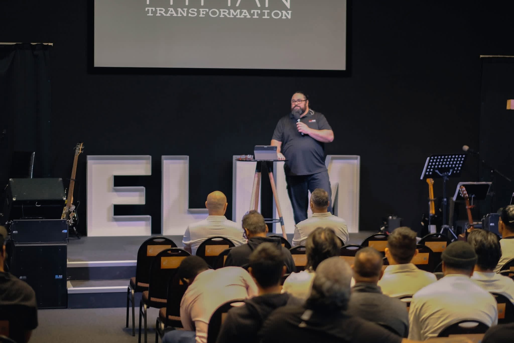 A speaker addressing the FITMAN audience