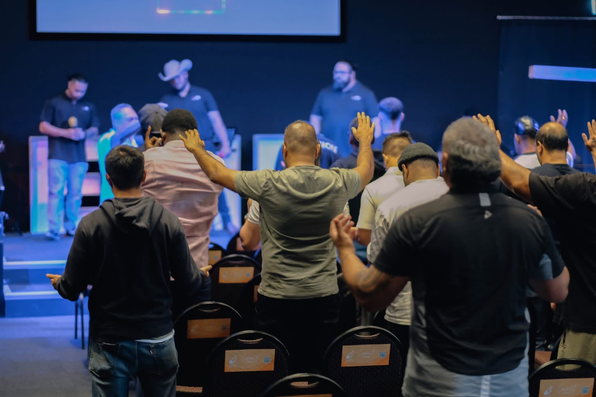Delegates participating in worship
