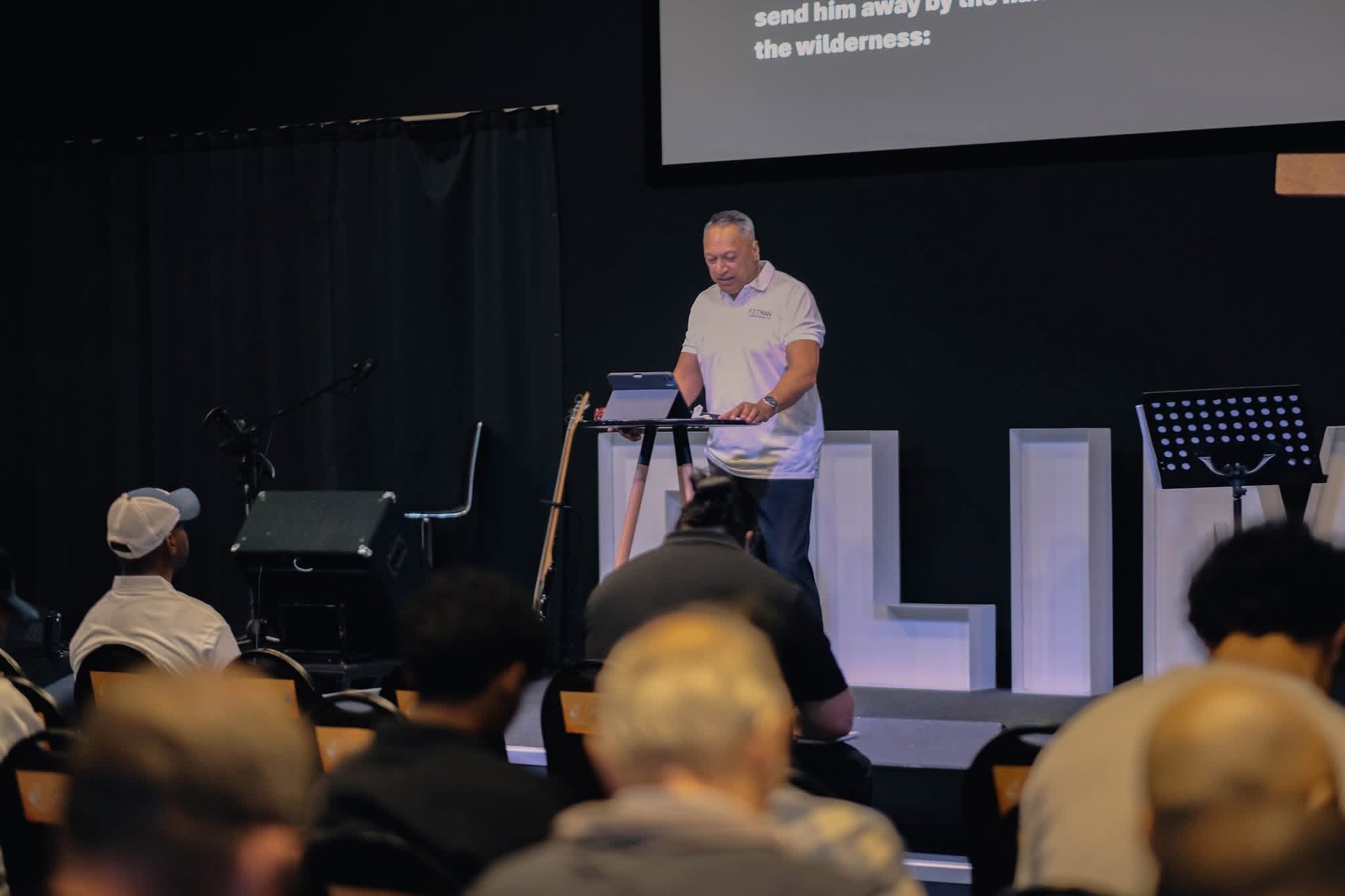 A conference speaker addressing the audience