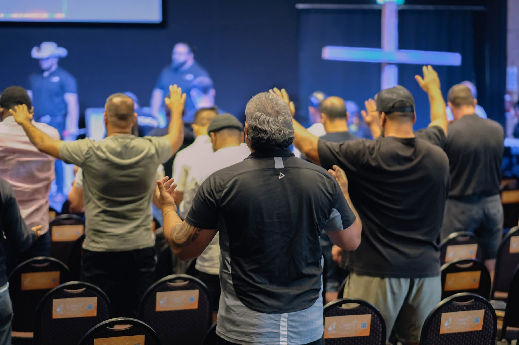 Men worshipping together at FITMAN