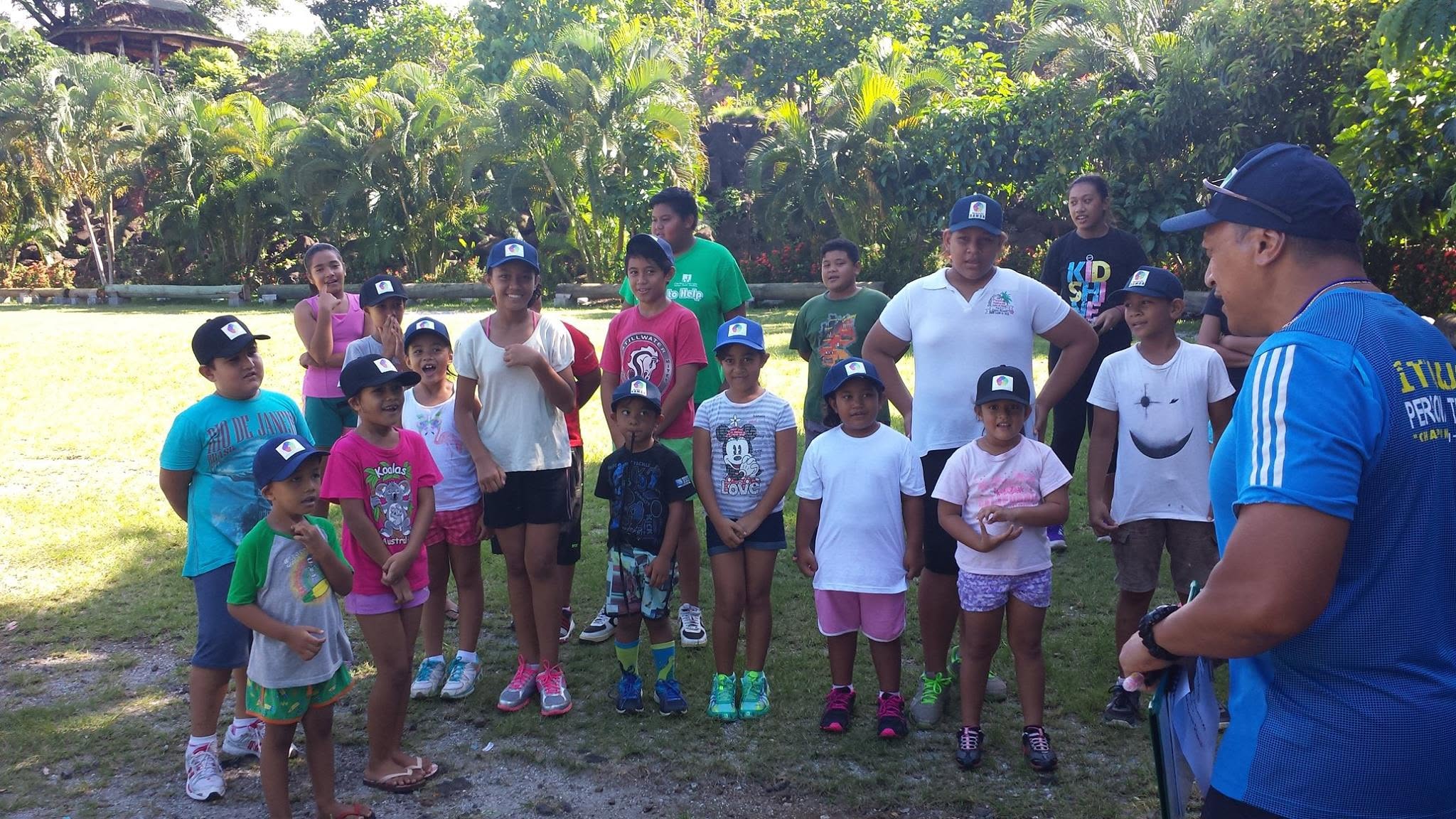 Children and adults gathered outdoors for a community activity
